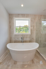 Fototapeta na wymiar modern bathtub has been installed in an updated bathroom