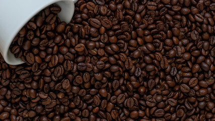 Flat lay texture of dark roasted arabica coffee beans background copy space