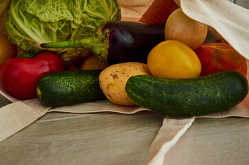 Organic vegetables in shopping bag.Potatoes, cucumber, onion, eggplant, cabbage, tomato, pepper.