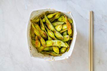 Take Away Steamed Edamame Bean, Green Soybean in a pan, East Asian Cuisine.