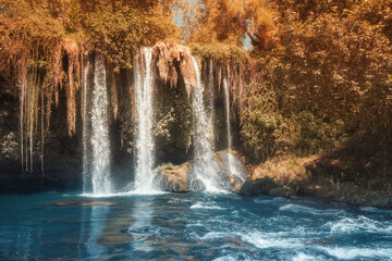 The upper Dyuden waterfall is a unique natural wonder not far from the center of Antalya. Golden soft light in early autumn in Turkey