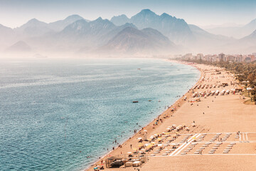 Fototapeta premium Aerial view of the famous longest Konyaalti beach in Antalya. Vacation and tour on the Mediterranean coast of Turkey