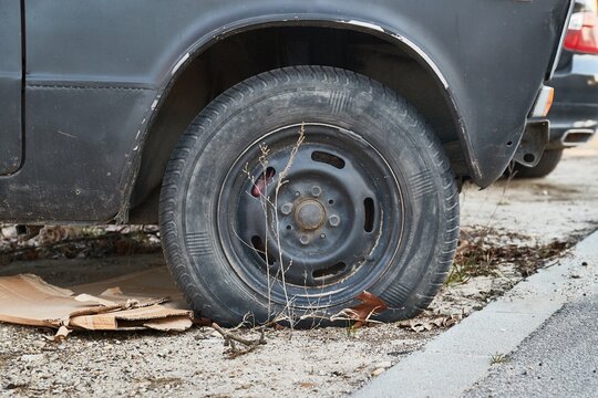 Flat tire of an old car wreck