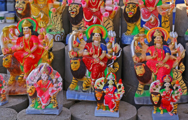Fototapeta premium Idols of Hindu Goddess Durga for Navratri festival in India. The nine-days festival, which commemorates the slaying of the demon king Mahishasur by goddess Durga, marks the triumph of good over evil.