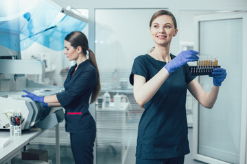 Happy scientific worker looking inspired by her research