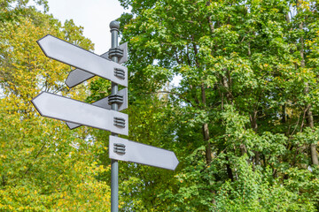 Iron street sign without signs and symbols during the day