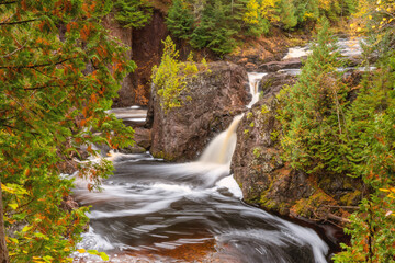 Water falls along Bad River at Copper Falls State Park during fall time	