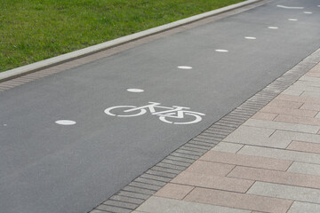 a special path with signs for cyclists in the city park