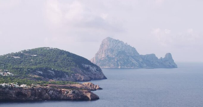 Es Vedra, Ibiza coastline, Balearic Islands, Cala Tarida cliffs and beach, stunning aerial footage of  the mediterranean sea