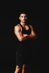 Fototapeta na wymiar muscular man on a black background