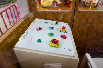 Buttons of different colors and sizes. Amusement park control panel in a toy style