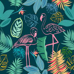 Naklejka premium Vector tropical jungle seamless pattern with flamingo, palm trees leaves and flowers