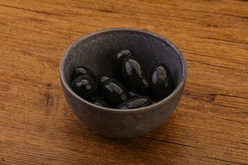 Pickled black olives in the bowl