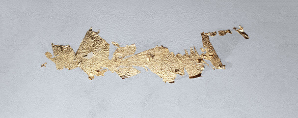 Grunge dirty texture wall with gold paper. Abstract background.