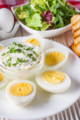 boiled chicken eggs on a white wooden rustic background