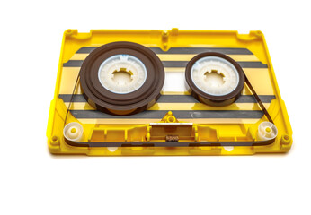 Fototapeta premium old yellow audio cassette tape on white background