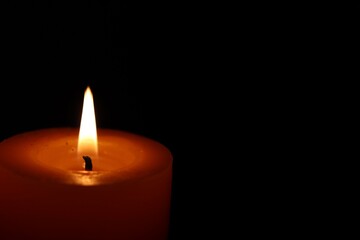 Candle black background of mourning funeral moment of silence