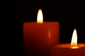Candle black background of mourning funeral moment of silence