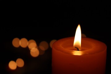 Candle black background of mourning funeral moment of silence