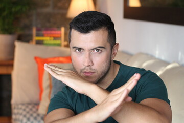 Funny young man doing karate position 