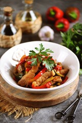 Spicy Asian pork with bell peppers, onions, ginger, garlic and cucumbers in soy sauce and rice vinegar.