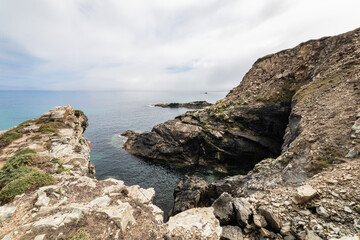 landscape of the coast of Galicia, Spain. You can see the cliffs and the sea on a sunny day with clouds
