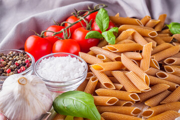 concept of traditional italian pasta with tomatoes and basil