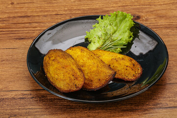 Baked potato with herbs and spices