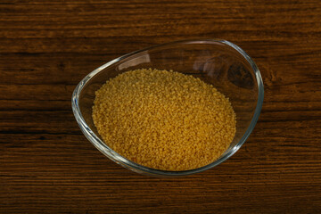 Raw cous cous heap in the bowl