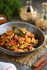 Stewed cabbage with zucchini, potatoes, meat and chorizo sausages.