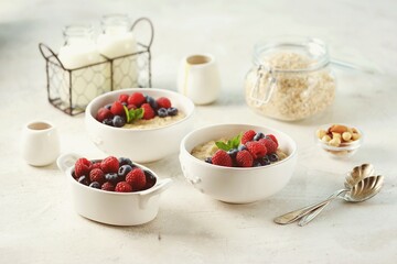 Oatmeal with fresh blueberries and raspberries. Healthy breakfast.