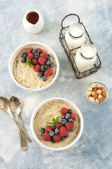 Oatmeal with fresh blueberries and raspberries. Healthy breakfast.