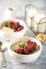 Oatmeal with fresh blueberries and raspberries. Healthy breakfast.