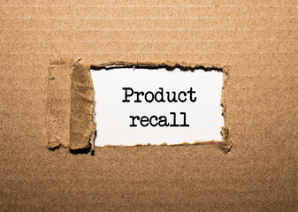 The text PRODUKT RECALL. behind torn brown paper