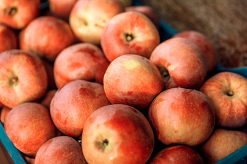 Fresh ripe red apples in the background