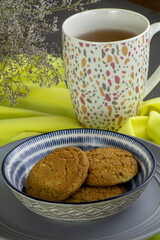 oatmeal cookies and a cap of tea