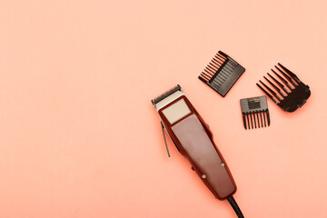 machine for a hairstyle. Barbershop. Hair clippers isolated on pink background. The machine for a hairstyle. Hair clippers isolated on pink background