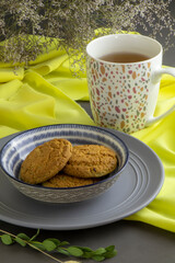 oatmeal cookies and a cap of tea