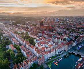 Fototapeta premium Aerial sunset view of the amazing old town and rivers of Gdansk with ships