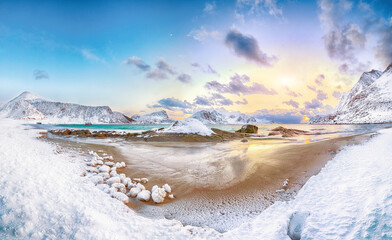 Fabulous winter scenery with Haukland beach during sunset and snowy  mountain peaks near Leknes.