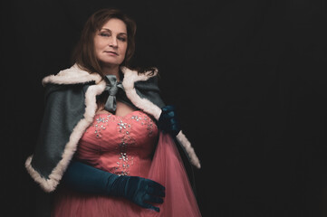 Woman in queen costume with mantle. artistic fantasy portrait of adult woman in royal dress