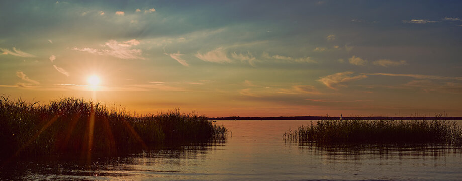 panoramic photo of a sunset over the lake Chiemsee in Germany