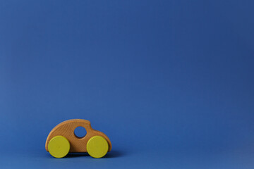 Wooden car on a blue background.