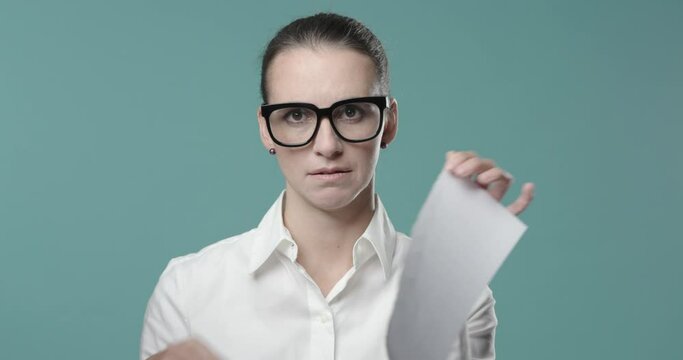 Disappointed woman ripping up a contract