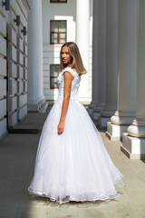 Young beautiful girl in ballroom prom dress