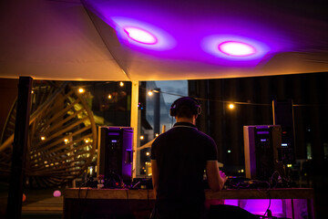 DJ plays music at an outdoor party