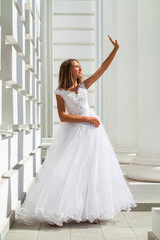 Young beautiful girl in ballroom prom dress