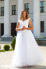 Young beautiful girl in ballroom prom dress