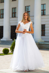 Fototapeta premium Young beautiful girl in ballroom prom dress