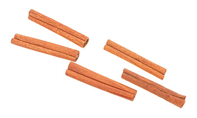 Top view of rolled cinnamon sticks isolated on a white background. Aromatic spice.